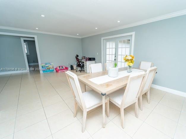 dining space with french doors, ornamental molding, and light tile patterned floors