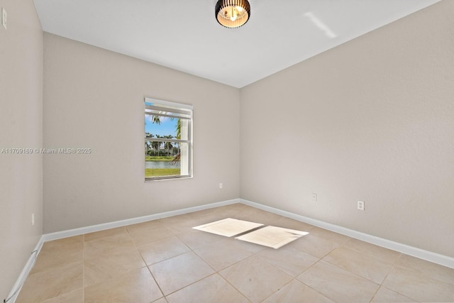 empty room featuring light tile patterned floors