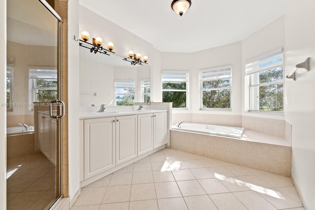 bathroom with separate shower and tub, vanity, and tile patterned floors