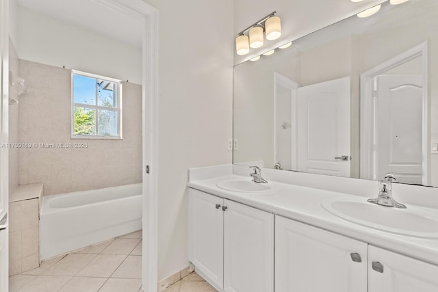 bathroom featuring vanity, tile patterned flooring, and a bathing tub