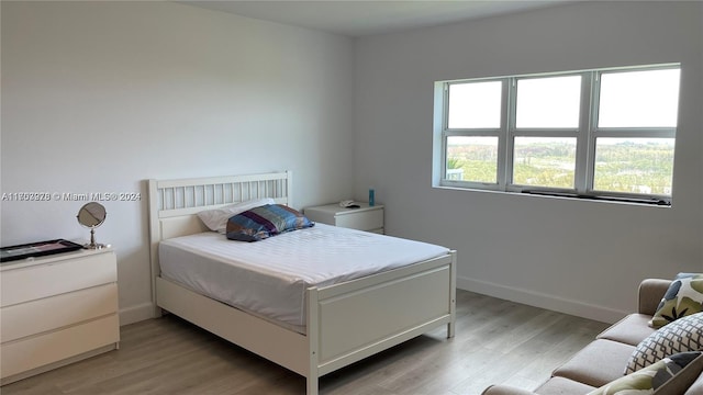 bedroom featuring light wood-type flooring