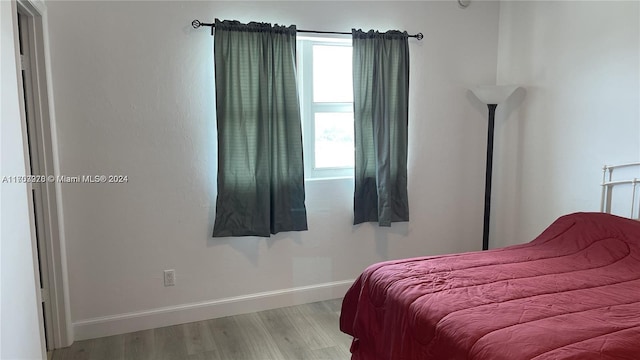 bedroom featuring light wood-type flooring