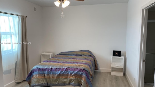 bedroom featuring ceiling fan and light hardwood / wood-style flooring