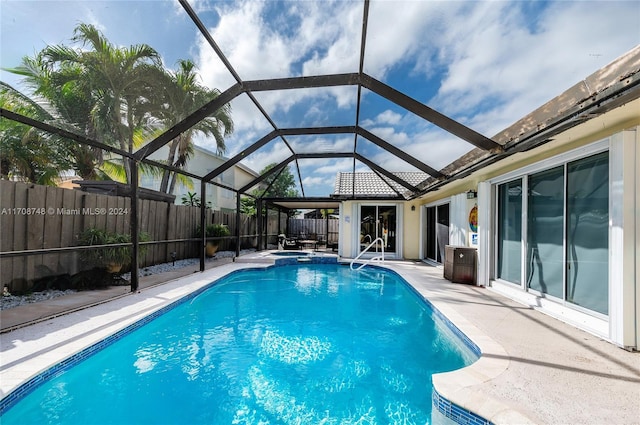 view of pool with a lanai and a patio