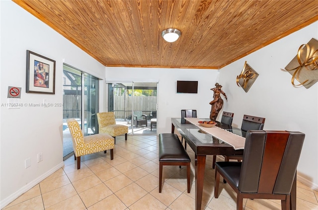 dining space with crown molding, wooden ceiling, and light tile patterned flooring