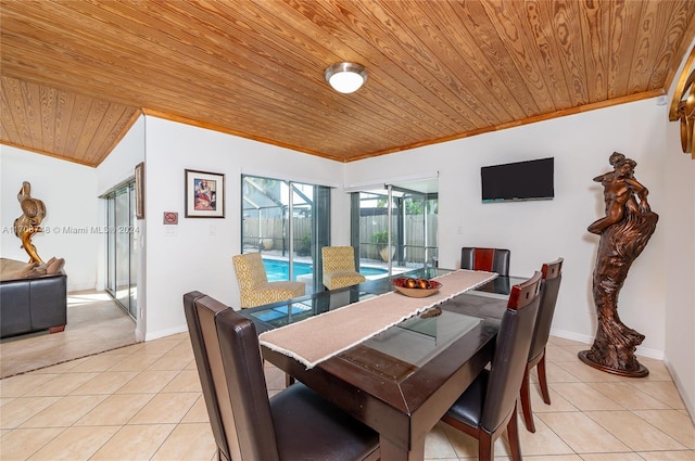 tiled dining area with crown molding, wooden ceiling, and lofted ceiling