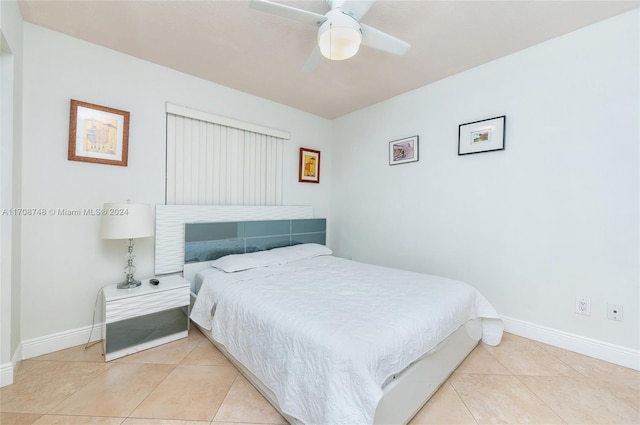 bedroom with ceiling fan and light tile patterned flooring