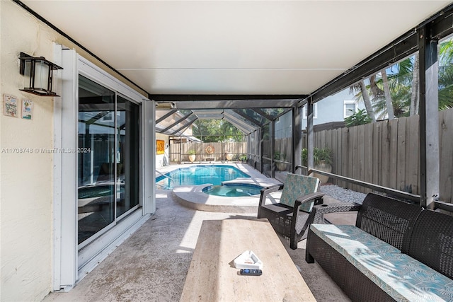 view of pool with a patio area and an in ground hot tub