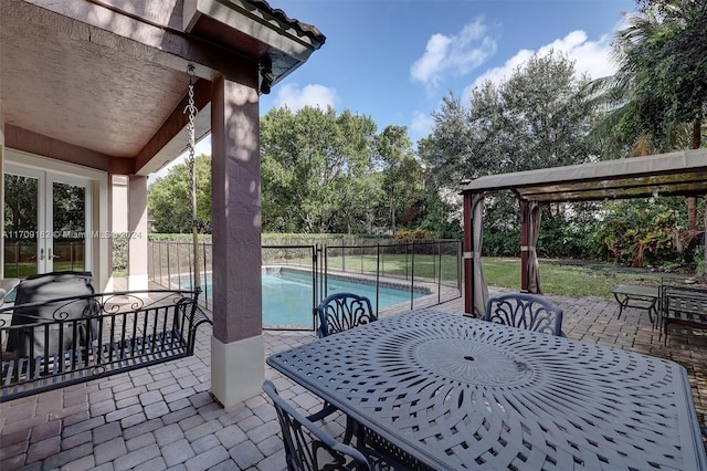 view of patio with a gazebo and a fenced in pool