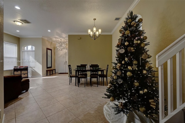 tiled dining area with an inviting chandelier and crown molding