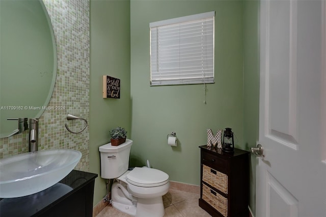 bathroom featuring tile patterned flooring, vanity, and toilet