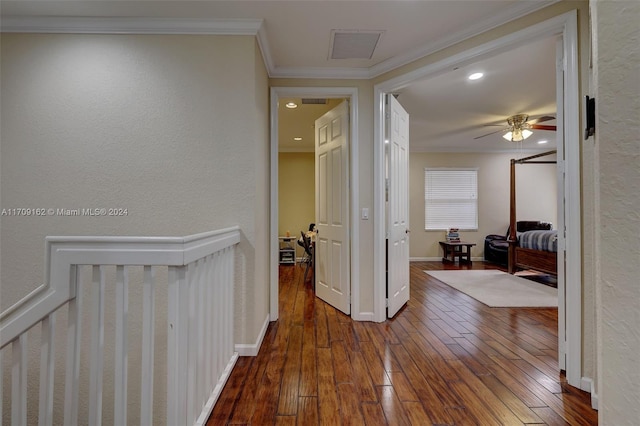 hallway featuring ornamental molding and dark wood-type flooring