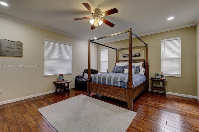 bedroom with dark hardwood / wood-style floors, ceiling fan, and ornamental molding