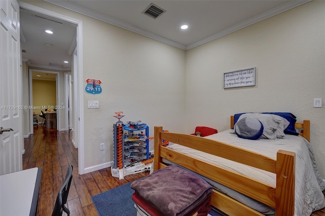 bedroom featuring dark hardwood / wood-style floors and crown molding