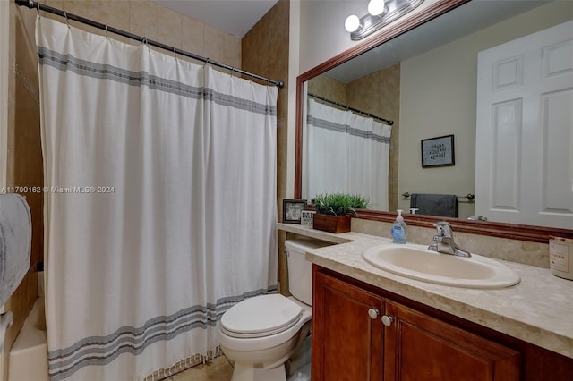 full bathroom featuring shower / tub combo, vanity, and toilet