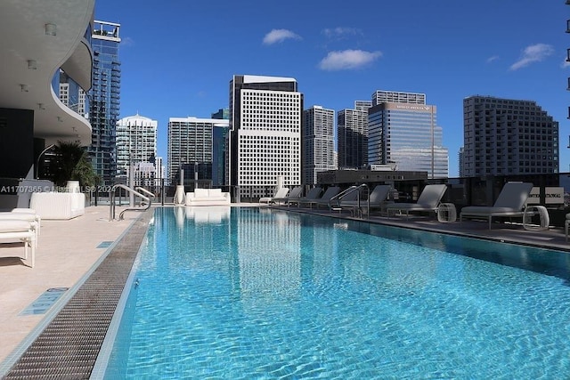 view of swimming pool featuring a patio area