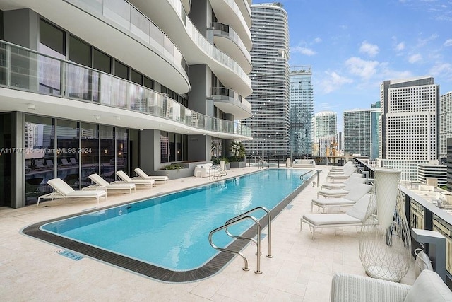 view of swimming pool featuring a patio