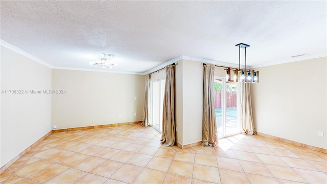 tiled empty room with crown molding and a textured ceiling