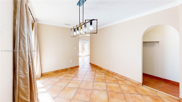 unfurnished dining area with light tile patterned floors and crown molding