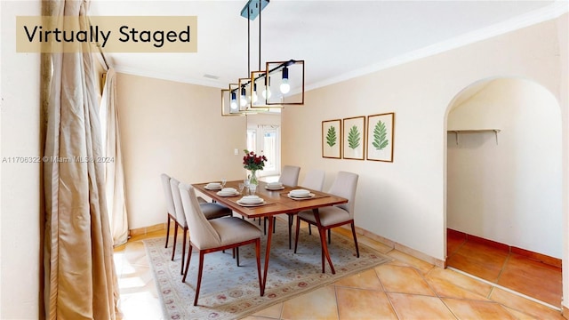 tiled dining room with crown molding