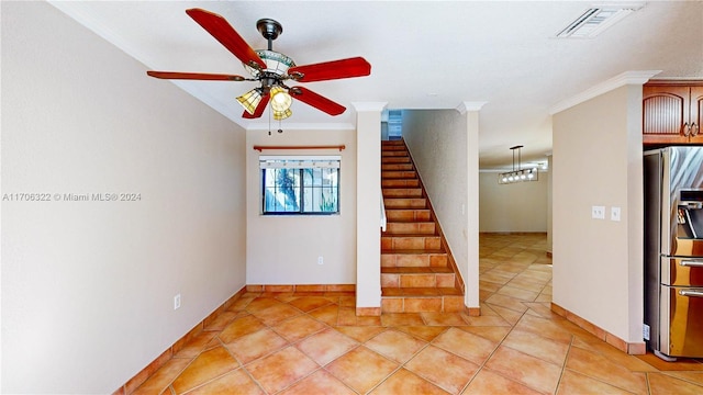 stairs featuring tile patterned flooring, ceiling fan, and crown molding