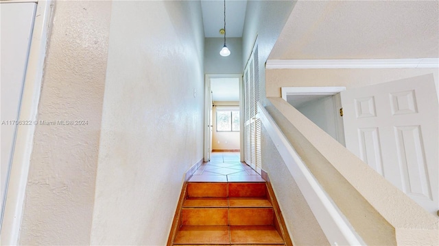 stairway featuring tile patterned flooring