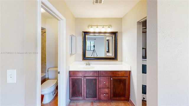 bathroom with vanity, toilet, and curtained shower