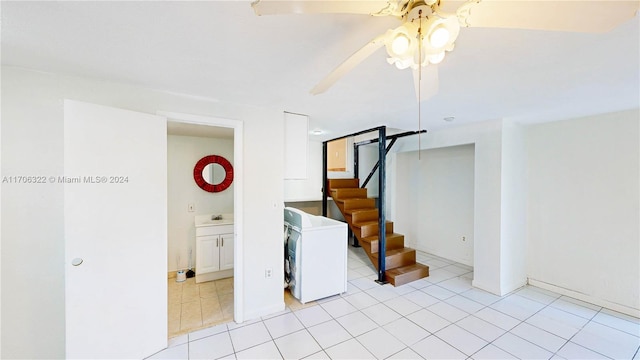 interior space with ceiling fan and washer / dryer