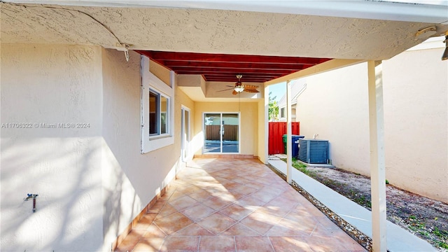 view of patio / terrace with ceiling fan and central AC unit