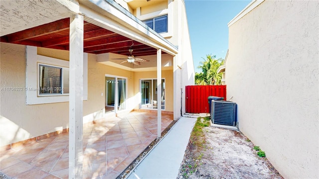 exterior space featuring central air condition unit, ceiling fan, and a patio