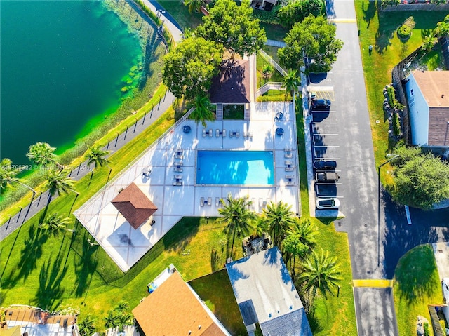 birds eye view of property with a water view