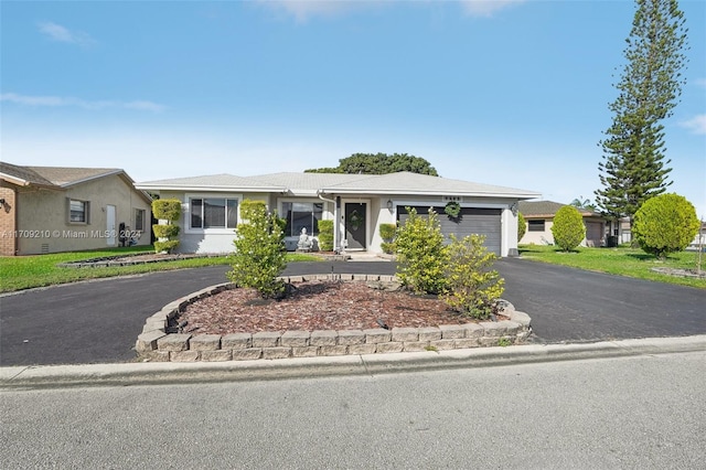 ranch-style home with a garage