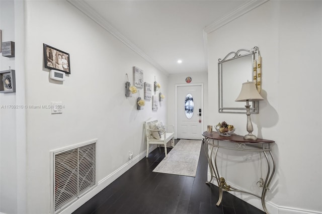 foyer featuring ornamental molding and dark wood-type flooring