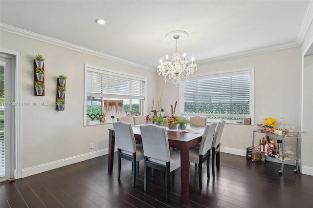 dining space with crown molding, dark wood-type flooring, and a chandelier