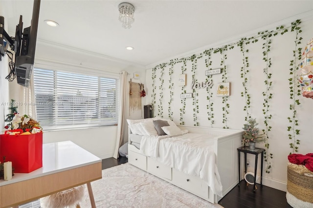 bedroom featuring hardwood / wood-style floors and ornamental molding