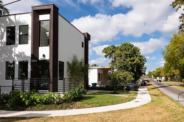 view of property exterior featuring a yard