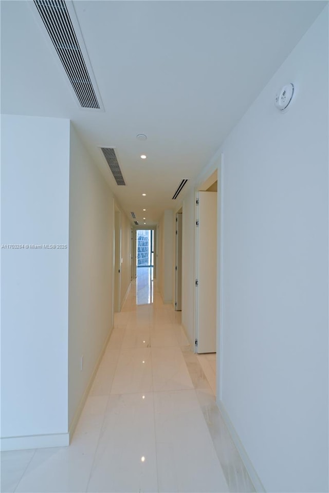 hall featuring light tile patterned flooring