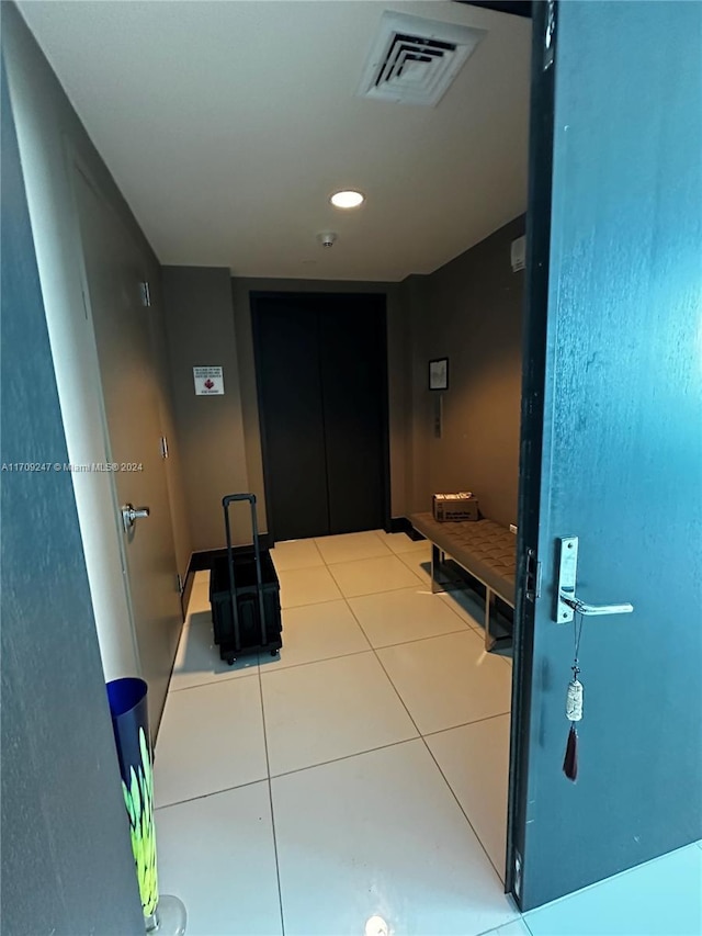 corridor with tile patterned flooring