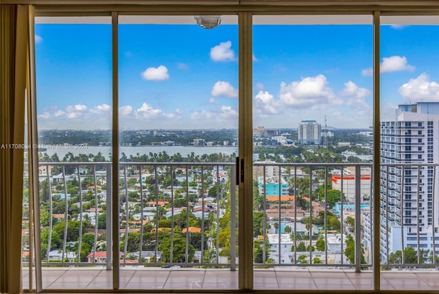 unfurnished sunroom featuring a water view