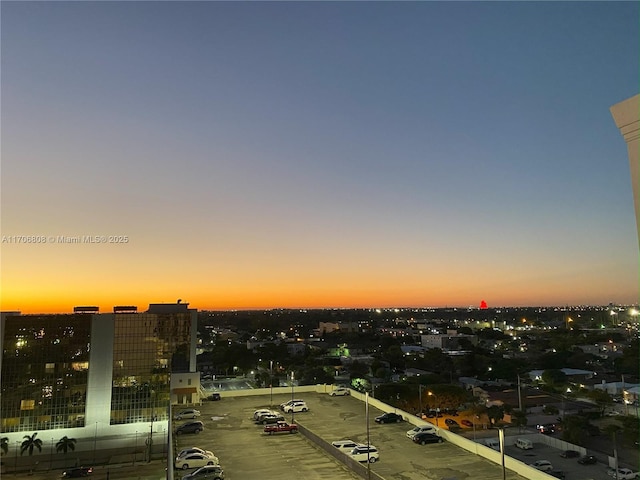 aerial view at dusk featuring a view of city