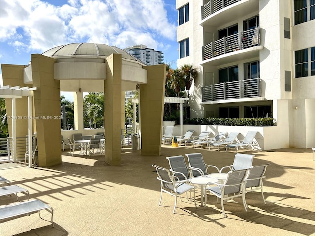 surrounding community with a patio area