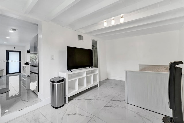 living room with beamed ceiling