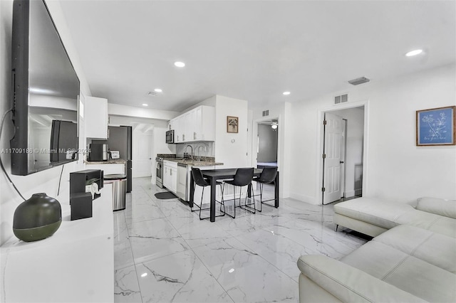 living room featuring sink