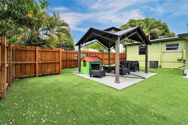 view of yard with an outdoor living space, a patio, and cooling unit