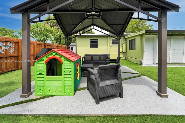 exterior space featuring outdoor lounge area and a gazebo