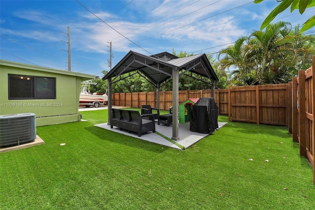 view of yard with a gazebo, an outdoor living space, cooling unit, and a patio