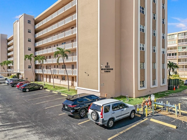 421 NE 14th Ave Unit 405, Hallandale Beach, FL 33009 - view of apartment building / complex with uncovered parking