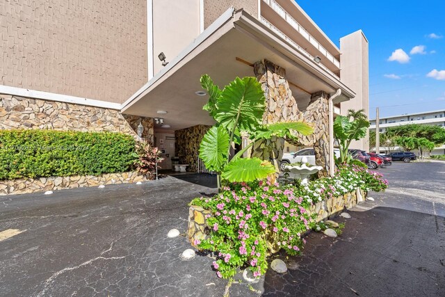 421 NE 14th Ave Unit 405, Hallandale Beach, FL 33009 - exterior view of stone siding and stucco siding