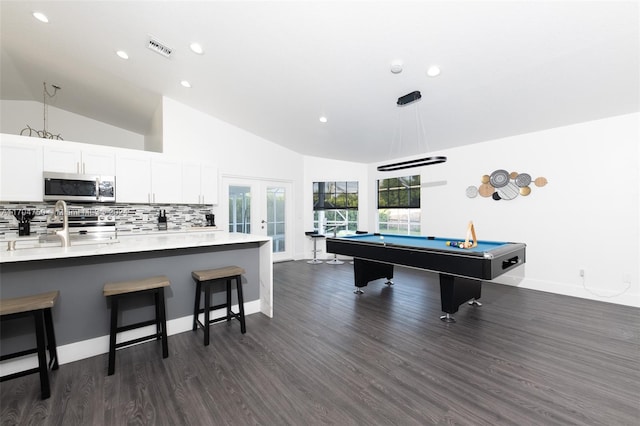 game room featuring high vaulted ceiling, dark wood-type flooring, billiards, and french doors