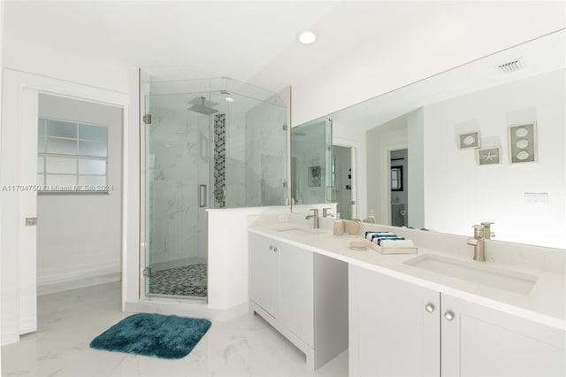 bathroom with vanity and an enclosed shower